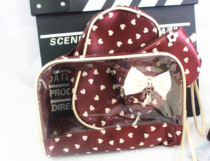 供應金華包包色丁桃心蝴蝶化妝包批發(fā)